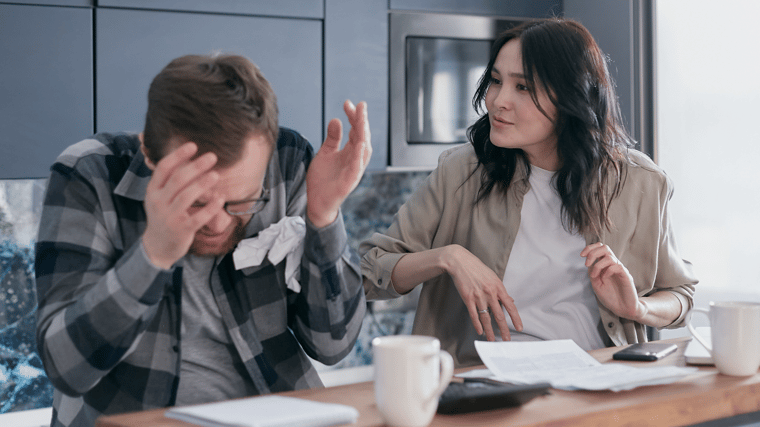 Business woman frustrated with guy in flannel who is cowering