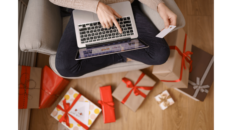 woman using card to do online shopping holidays