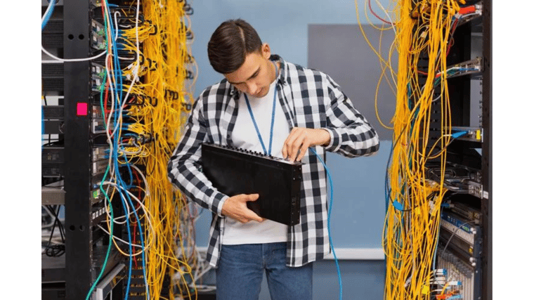 guy working with computer and cords