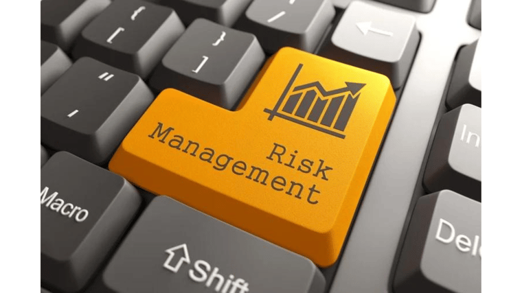 orange risk management button on keyboard cyber risk management