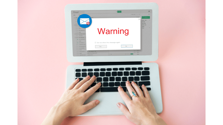 warning sign on laptop fraud social engineering attack