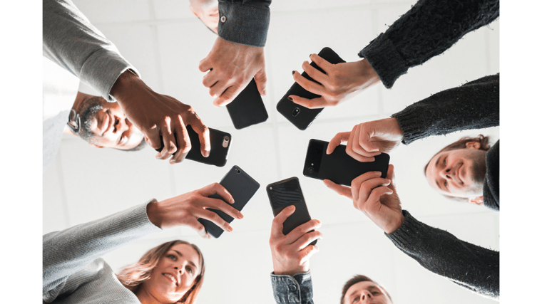 circle of people around mobile devices mobile collaboration with Microsoft Teams