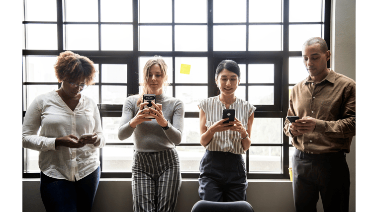 group of people on their phones mobile collaboration