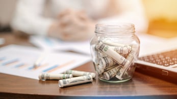 jar with money focus on cost