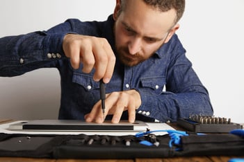 professional-accurately-unscrewing-case-metallic-slim-laptop-his-electric-service-lab-near-tool-bag-clean-repair-it-front-view