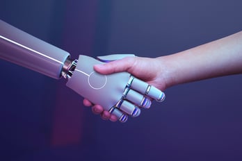 human and robot shake hands automation and ai