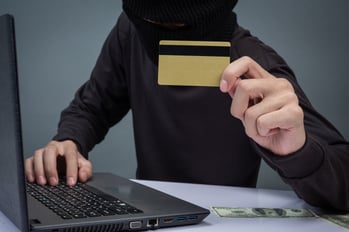 dangers of token hijacking understanding token hijacking thief holding credit card